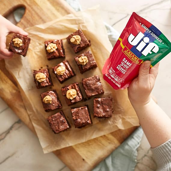 Jif Squeeze Creamy Peanut Butter Spread, 7g Protein (7% DV), 13 Oz. Pouch | 7g protein per serving, 7% DV, See nutrition information for fat and saturated fat content, Resealable pouch